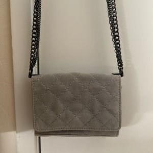 Suede crossbody bag with quilted design and metallic chain straps